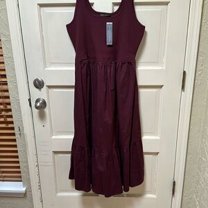 Never been worn! This is a beautiful dress that is perfect for all seasons